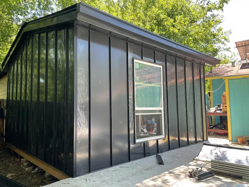 Black standing seam metal wall panels for Roof Inspection in Ada